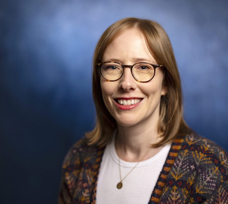 WATERVILLE, MAINE – NOVEMBER 19: Kelly Brignac, Assistant Professor of History, poses for a portrait in the Coburn-Smith Library in the Schair-Swenson-Watson Alumni Center on Tuesday, November 19, 2024. (Photo by Ashley L. Conti)